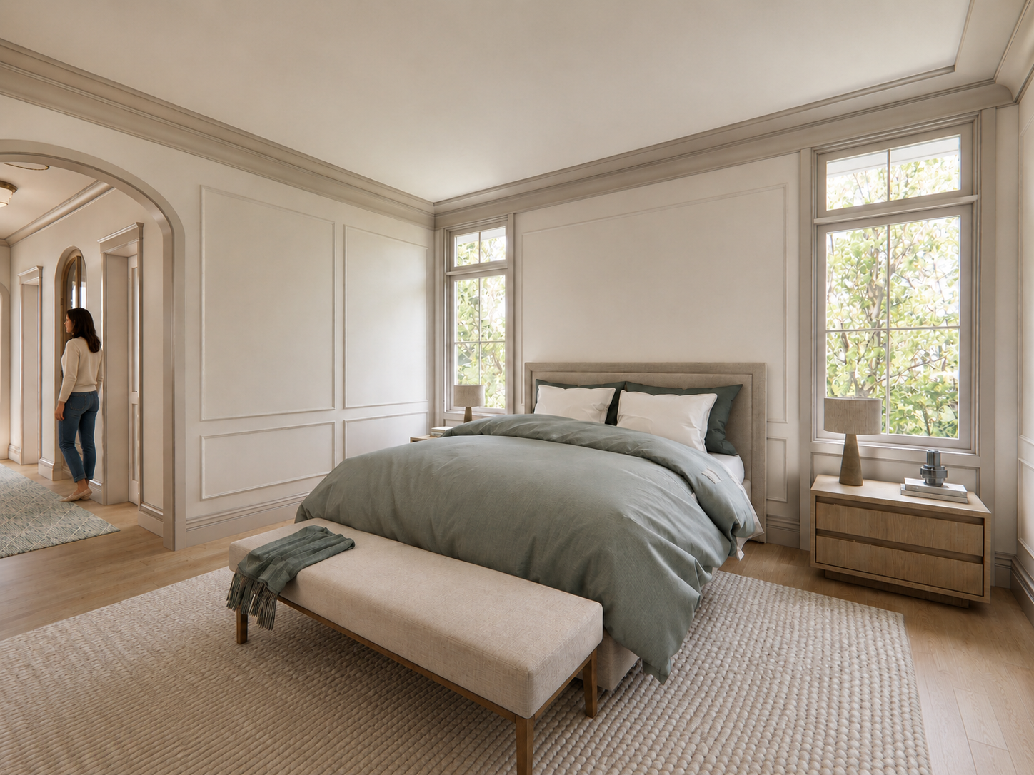 custom primary bedroom overlooking wooded property